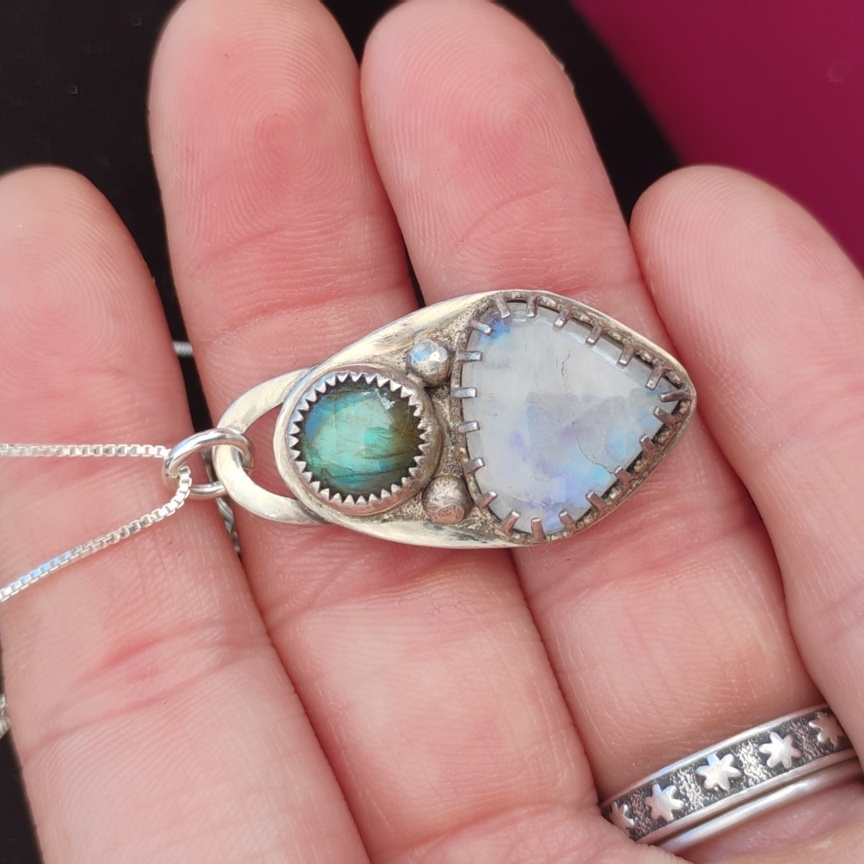 Iridescent Silver Necklace With Blue And White Stones